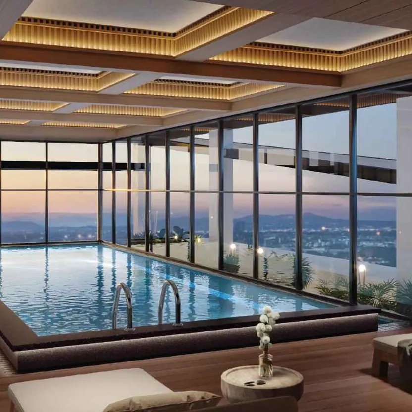 Aratt Ayatana Residences, artistic impression The heated rooftop pool on the Skydeck, with the city beyond its glass walls